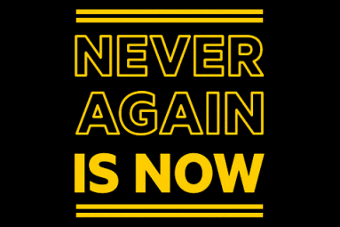 Banner saying Never Again Is Now
