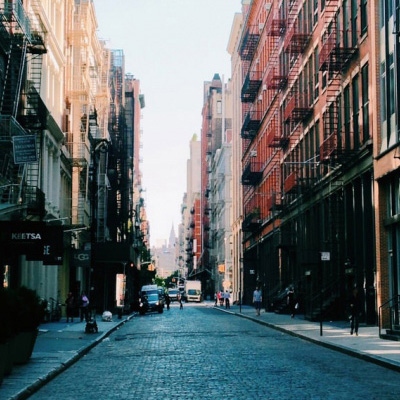 Placeholder image features a photo of a brick-covered street in NYC